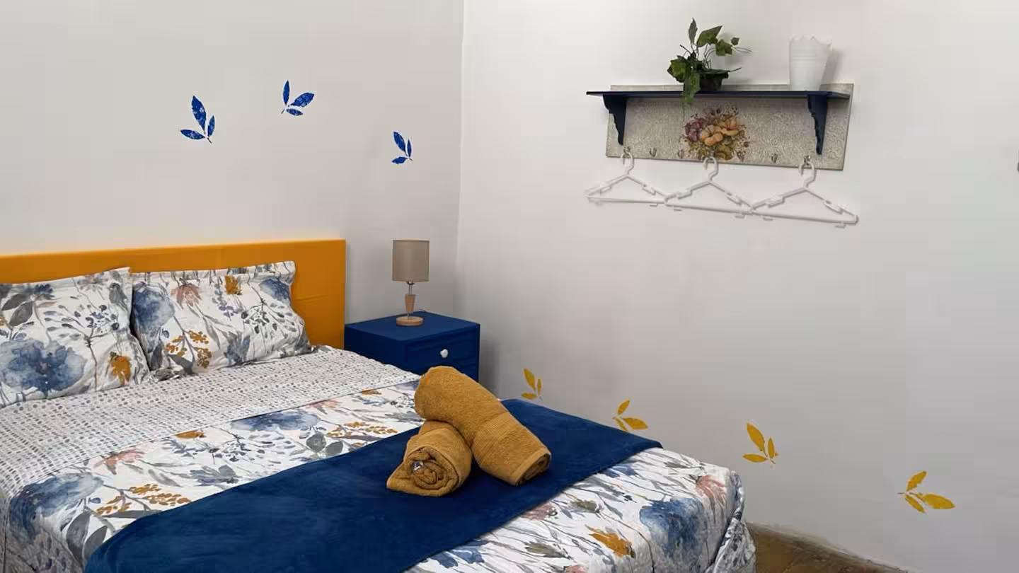 Bathroom with traditional patterned tiles and amenities