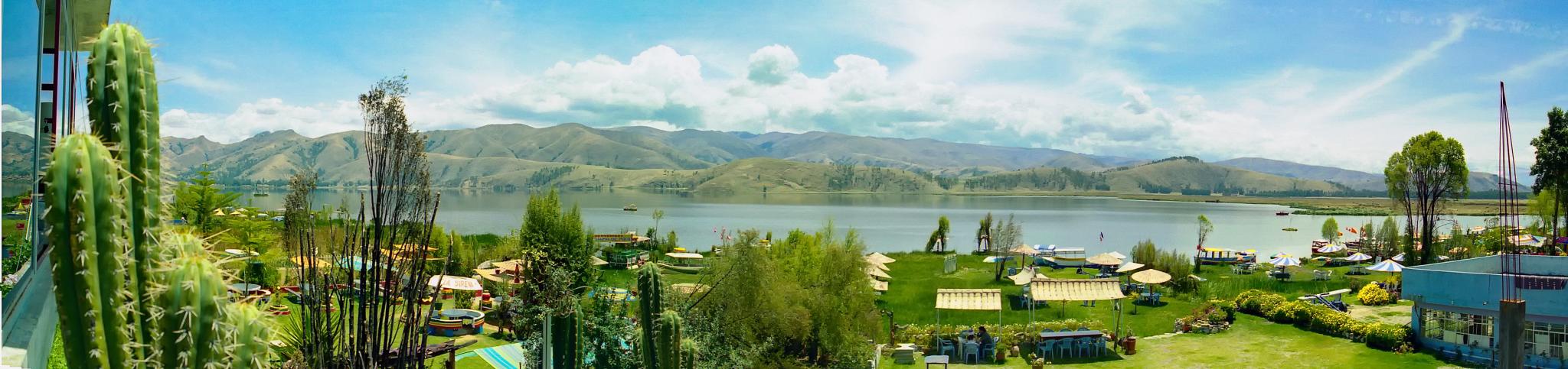 Laguna de Paca panoramic view with mountains and lake